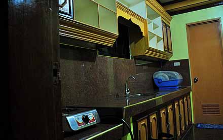 The Kitchen with Gas Stove, Cabinets, Rest Room (1st Floor)